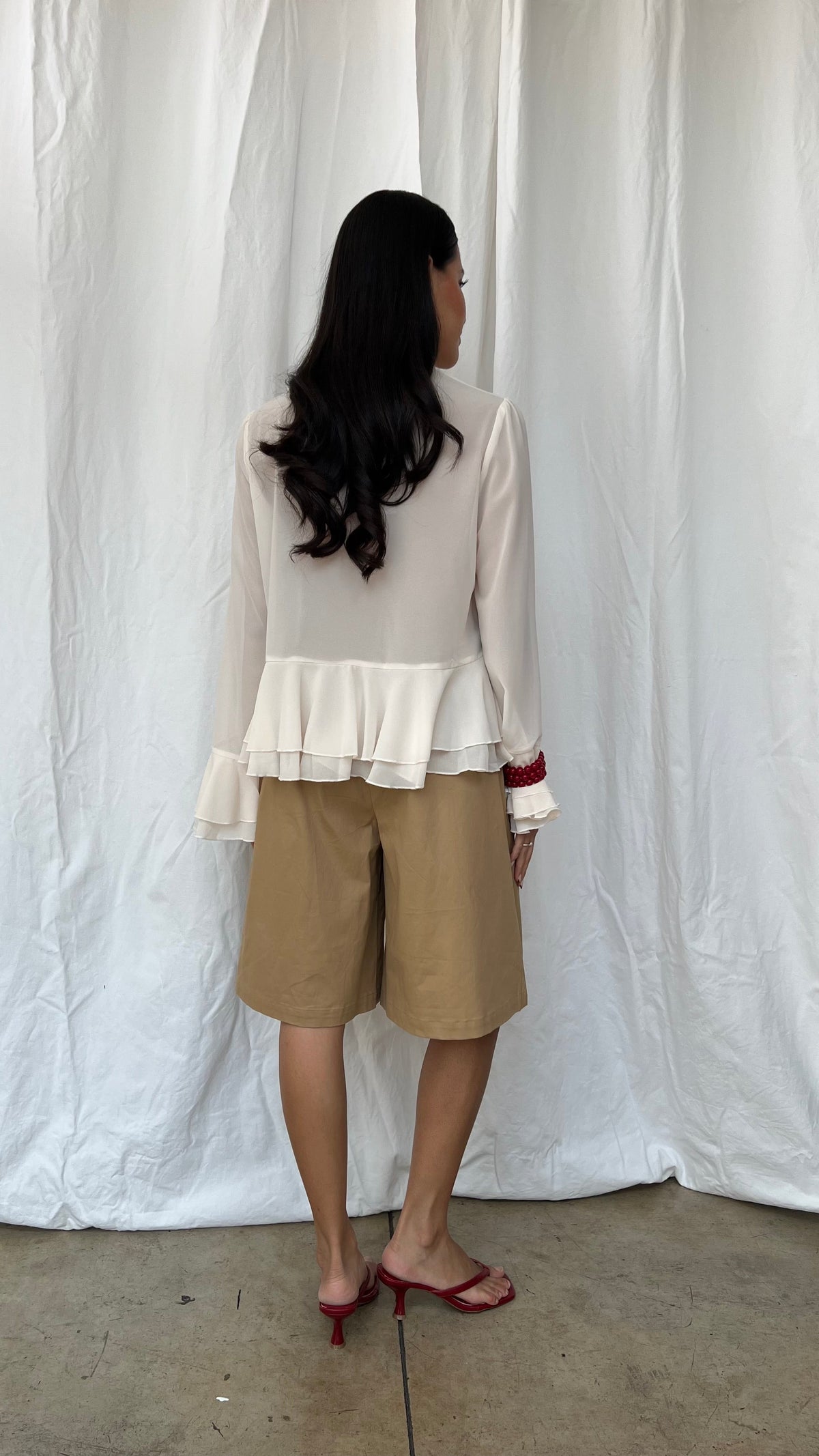 Top Peplum manga larga