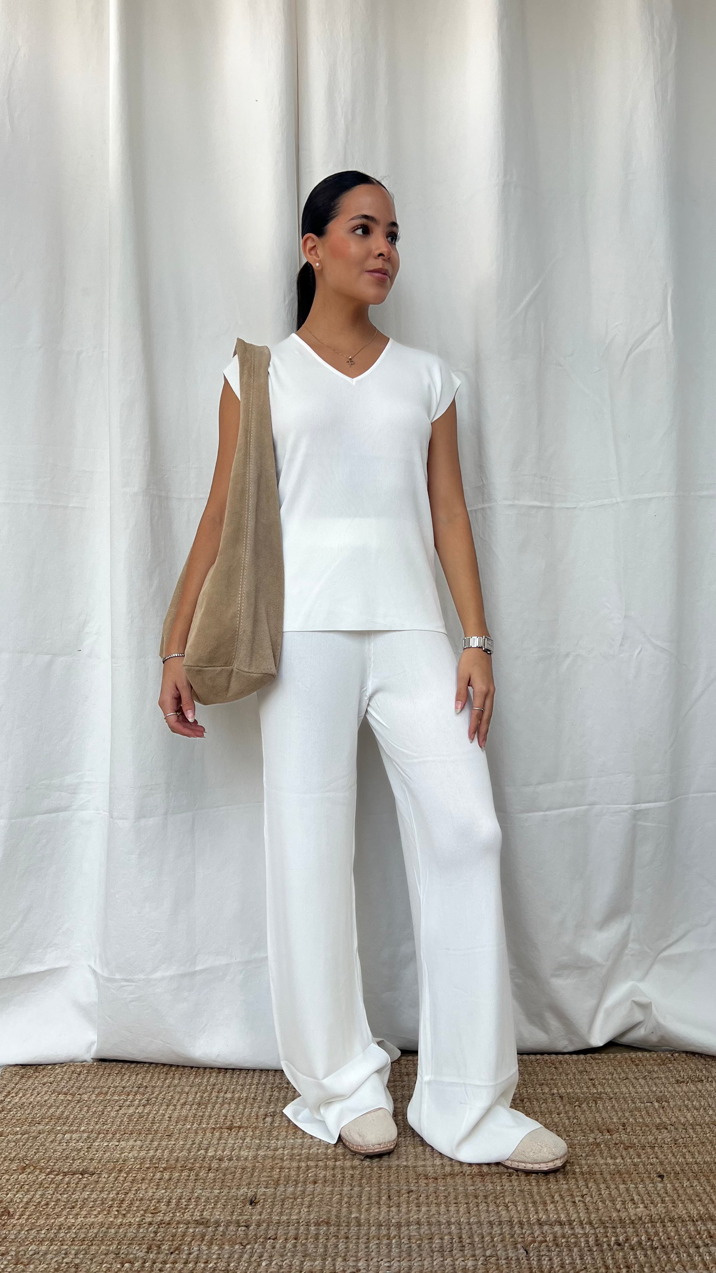 Set de punto de blusa y pantalón en blanco