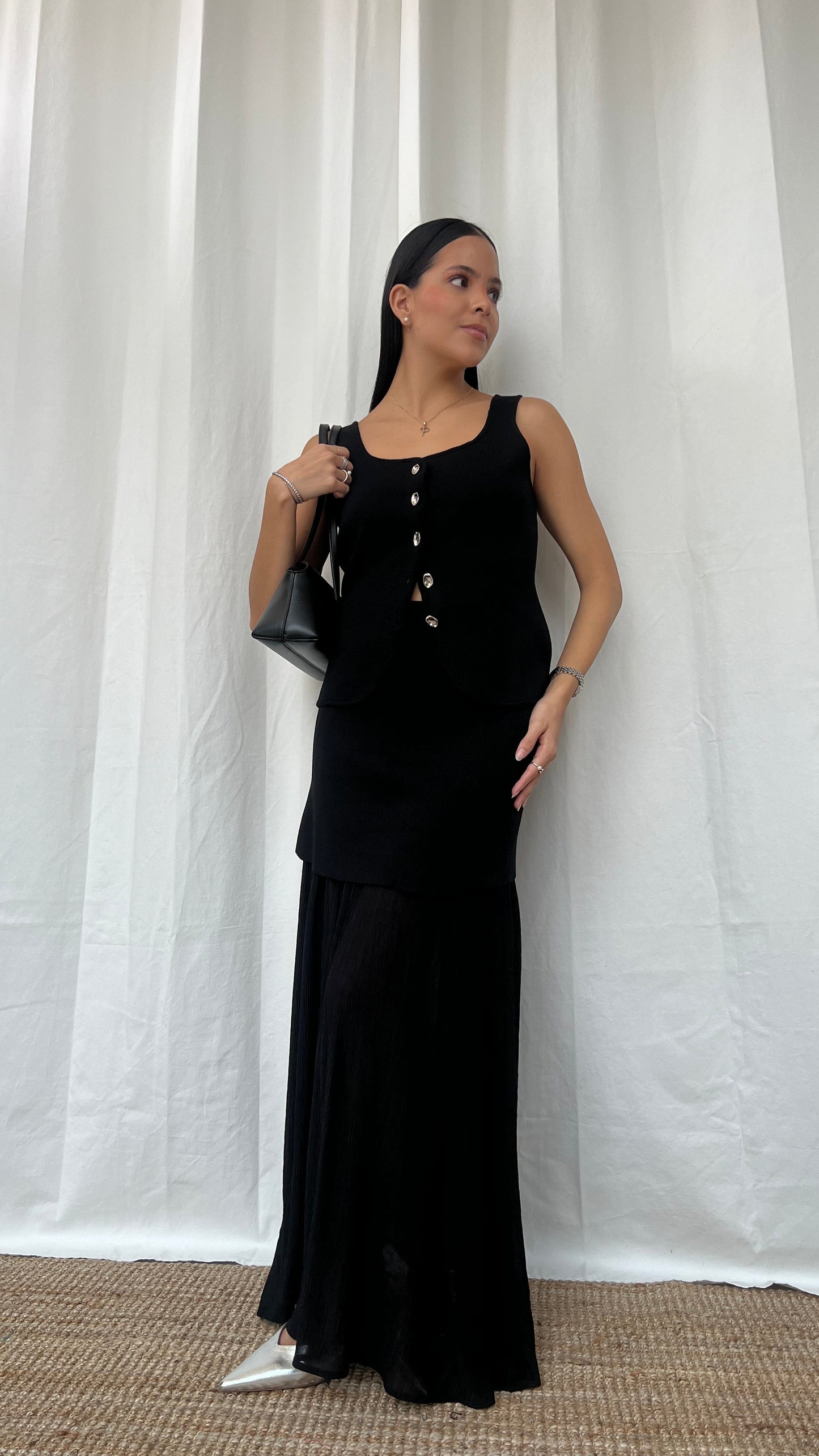 Set de chaleco y falda negra
