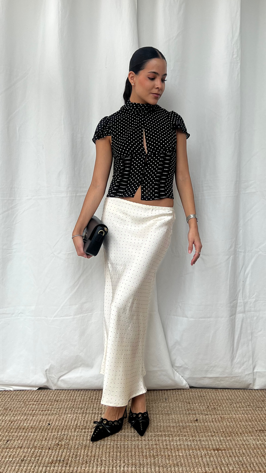 Falda midi corte recto de puntos en blanco